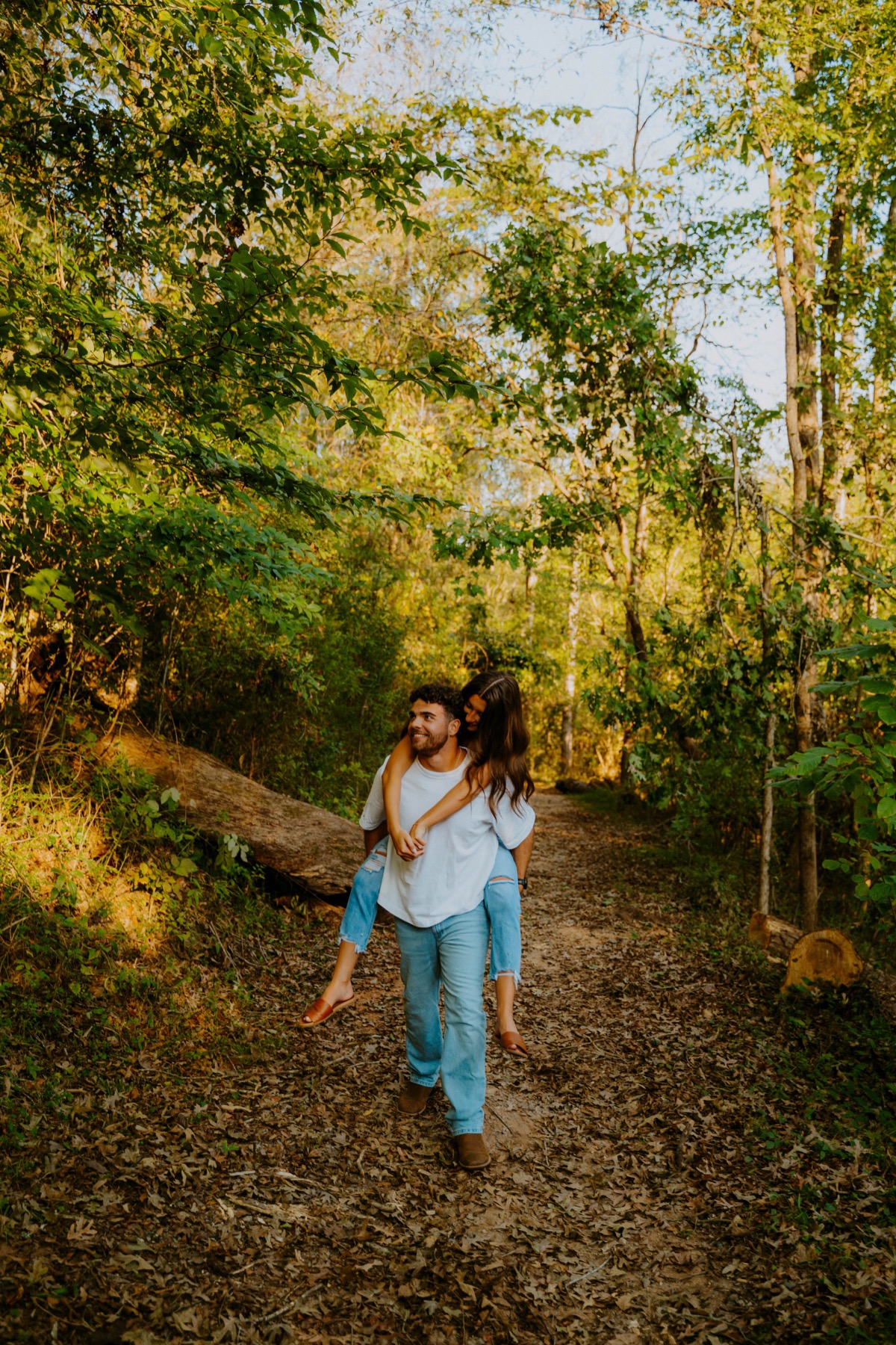Hunter and Hannah walking together on a wooded trail